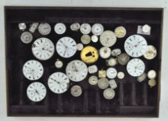 A collection of watch faces, of assorted sizes, materials and designs