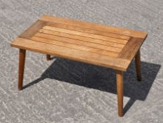 A teak garden coffee table,