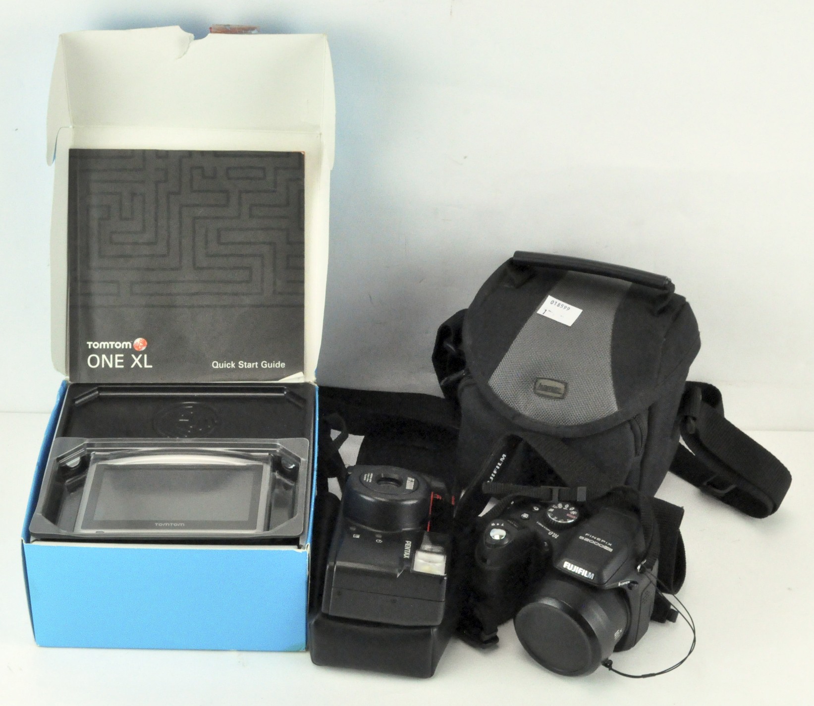 A Pentax zoom 70-s camera and case, Finepix S2000HD digital camera, with manual, leads and case,