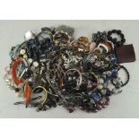 A box of costume jewellery, comprising necklaces, bangles, bracelets, rings and other pieces