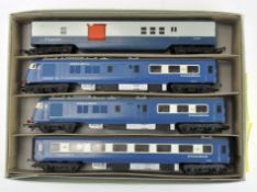Three Triang Hornby 00 gauge blue Pullman cars together with a Royal Mail Coach
