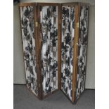 A retro four-panel screen made of grape-patterned material suspended in teak wood frames,