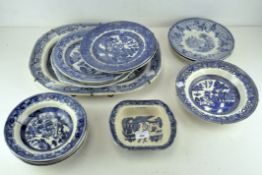A collection of Staffordshire pottery 'Willow' pattern wares and other blue and white pottery