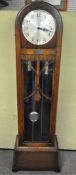 An inter-war period oak long case clock with glass door, dial stamped Made in England,