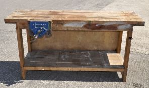 A vintage work bench with a Record No 52 1/2 E vice attached,