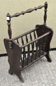 A stained wood magazine rack,
