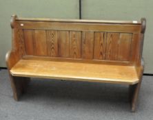 A pitch pine pew, numbered 30 at one end, 92.