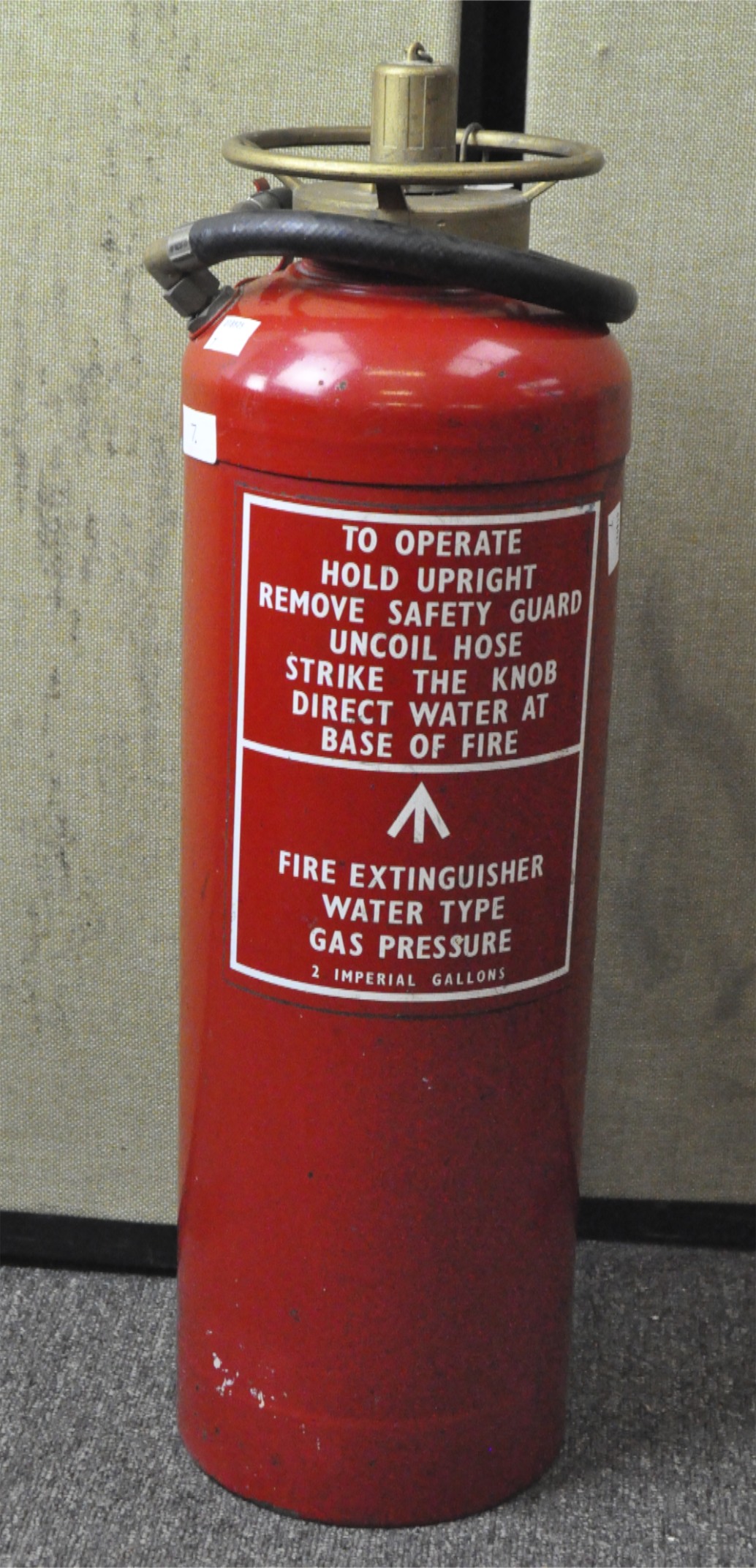 A 1975 fire extinguisher by 'Thomas Glover & Co.