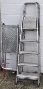 Two five tread step ladders together with a platform step ladder