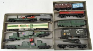 Six Triang 00 gauge military themed transporters including a Warheads wagon, helicopter, cars,