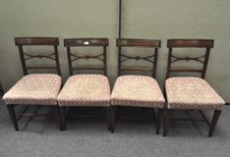 A set of four Regency style mahogany chairs, with bar and pierced backs,