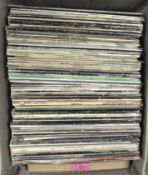 A box of vinyl records, including assorted Blues albums, Billie Holiday, Robert Johnson, Otis Rush,