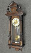 A Vienna style wall clock, with ivorine chapter ring and gilt-metal centre,
