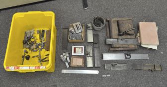 A selection of traditional printing equipment including locking equipment, a metal pot, forms,