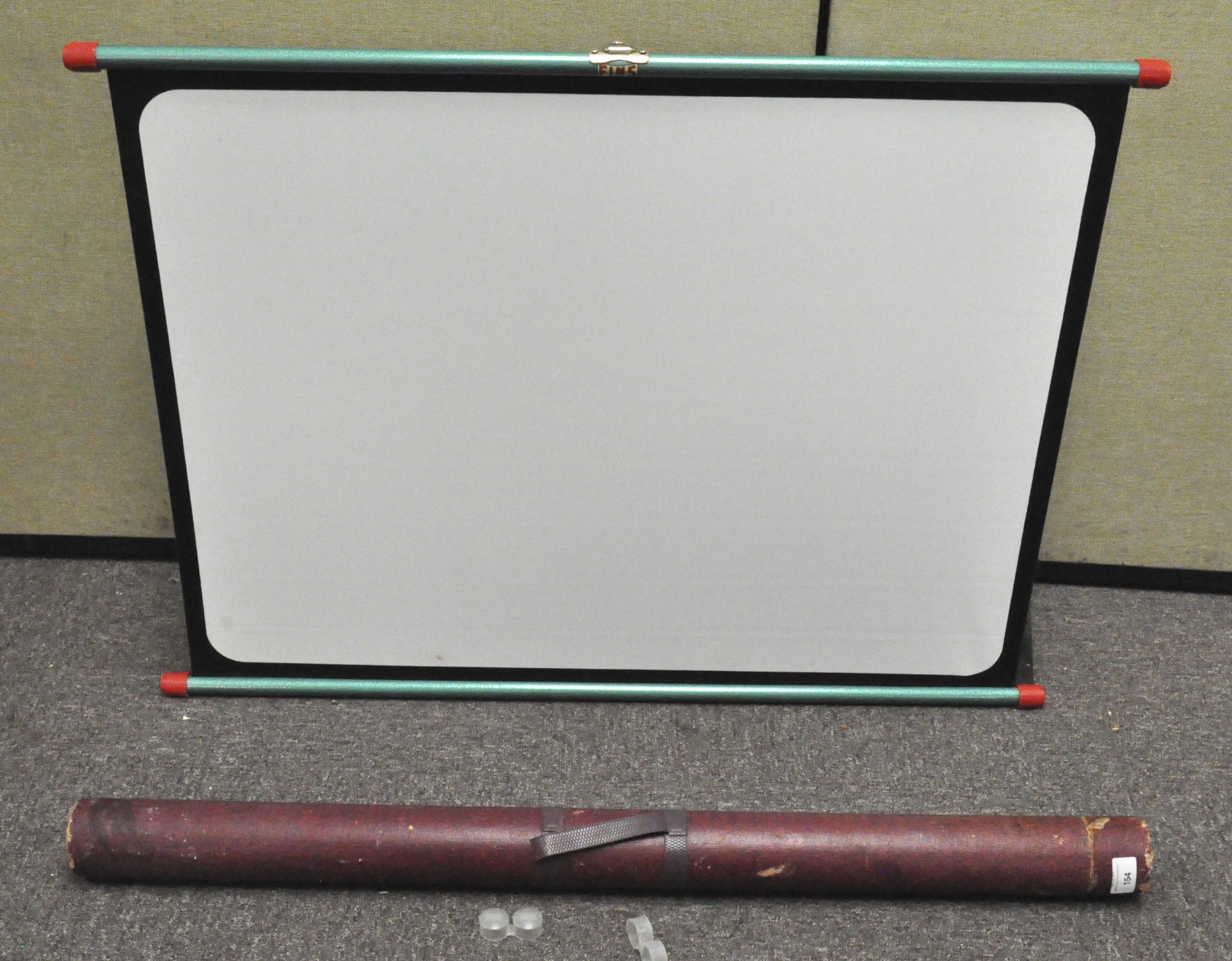 A projector screen, with folding metal supports, in tube, approx.