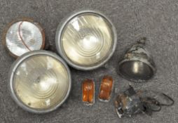 A pair of Classic car headlights, together with two others,