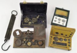 A collection of vintage scales, including two boxed sets of scale weights,