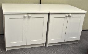 Two contemporary white painted two door cupboards, 67.5 cm x 73 cm wide x 65.