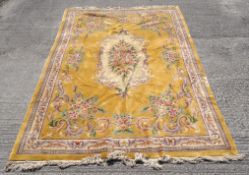 A modern Chinese large floral carpet with a yellow ground,