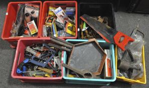 A mixed collection of tools including old wrenches, pliers, lamps, bolts, spring clamps,