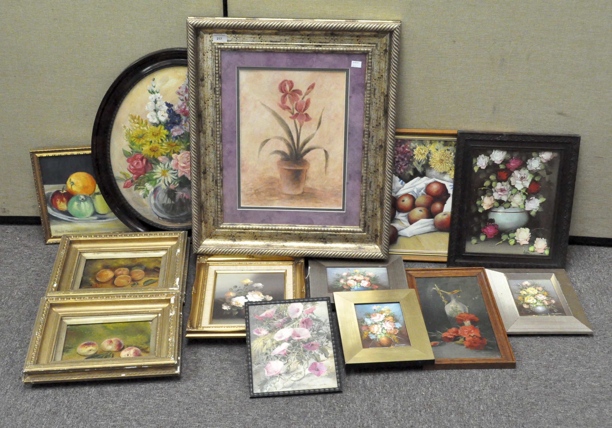 A collection of watercolours and prints, including a 1930s watercolour portrait of a lady,