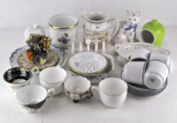 A selection of various 20th century ceramics to include tea cups, dishes, an ornamental cat,