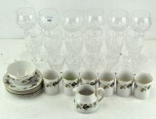 A group of cut crystal drinking glasses and a Doulton Larchmont pattern part coffee-service