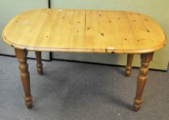 A contemporary extendable pine dining table with rounded corners, height 75 cm, width 90 cm,