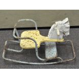 A Triang rocking horse with blue painted metal frame and yellow seat and white plastic horses head,