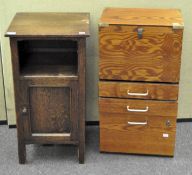 An oak bedside/pot cabinet together with a modern wood filing cabinet