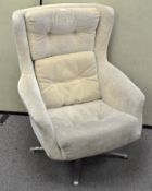 A 1960's retro vintage swivel batwing lounge chair,