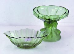 A contemporary green glass bowl in the Art Noveau style, featuring three kneeling women,