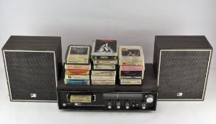 A Kyoto S-700 MPX 8 track tape stereo system with speakers and a selection of tapes