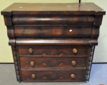 A Victorian mahogany chest of drawers, comprising a bureau above three long graduated handles,