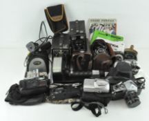 A collection of cameras, including an AGFA-BOX, Sony digital camera, Praktica and more,