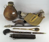 A selection of tribal and oriental collectables, including an Opium pipe with jade mouth piece,