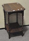 A small mahogany occasional table of octagonal form with turned supports,