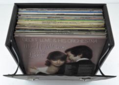 A selection of vinyl records including The Wombles, German Drinking Songs, and two Madonna records,