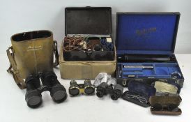 A pair of military binoculars, in original leather case, and other items