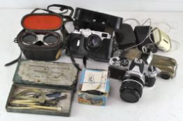 Assorted cameras and photography equipment to include a Zorki 4K, a Nikon, vintage light meters,