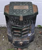 A French green glazed Art Deco style stove, 'Lily-X Deville',