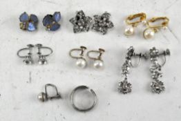 A collection of earrings and a ring