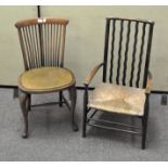 Two Arts and Crafts style chairs including a low chair with wavy vertical back rails,