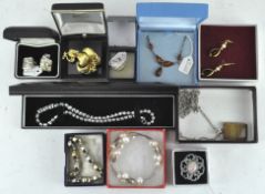 A group of costume jewellery including a bangle, bracelet,