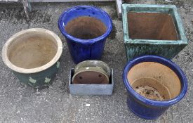 A collection of blue and green glazed planters of various shapes,