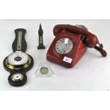 A vintage red telephone together with a barometer and further items