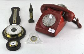 A vintage red telephone together with a barometer and further items