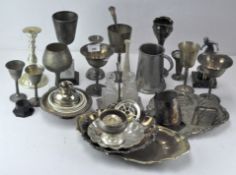 A group of silver plated and metal ware, including fluted dishes, cups, mugs, sugar bowl,