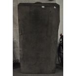 A large black canvas bound trunk,