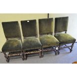 A set of four oak framed dining chairs with barley twist supports, upholstered in green velvet,